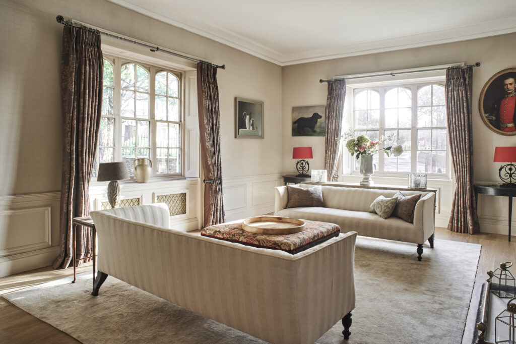 a living room filled with furniture and a large window