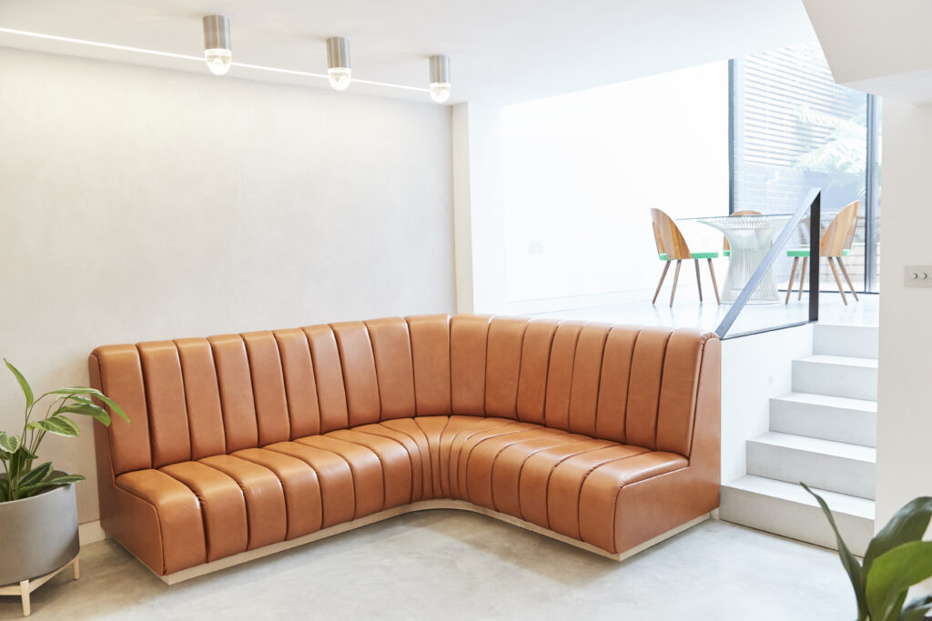 a living room filled with furniture and a large window