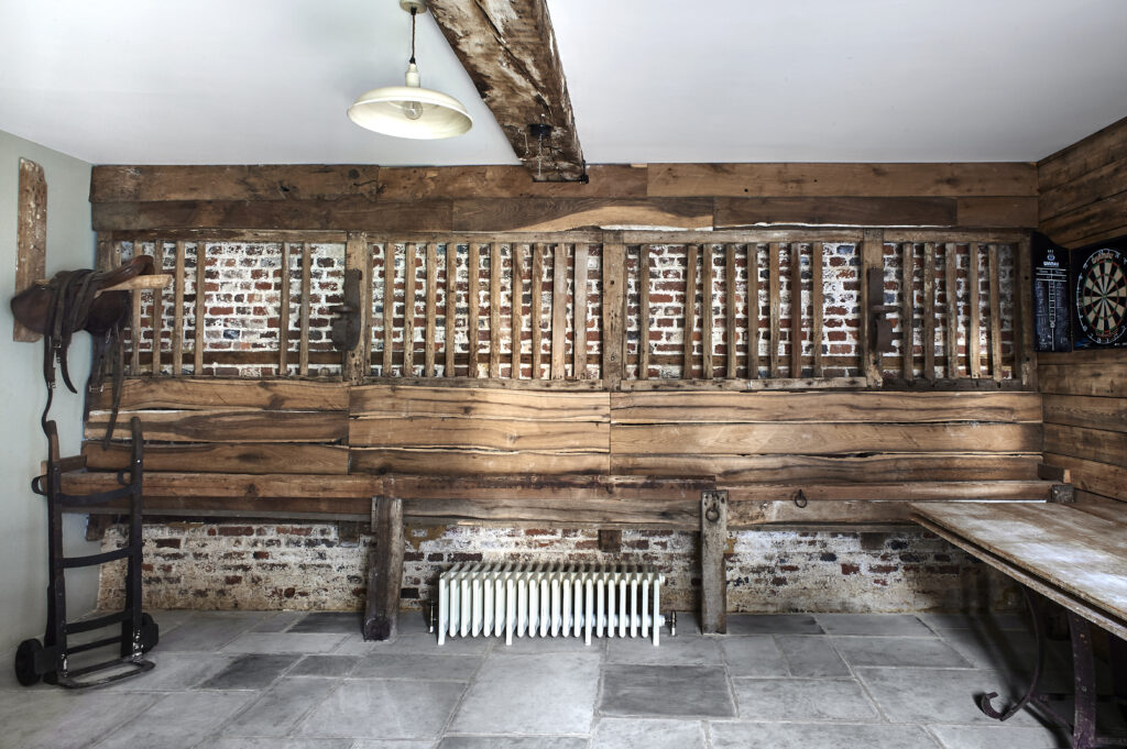 a wooden bench sitting in the middle of a room
