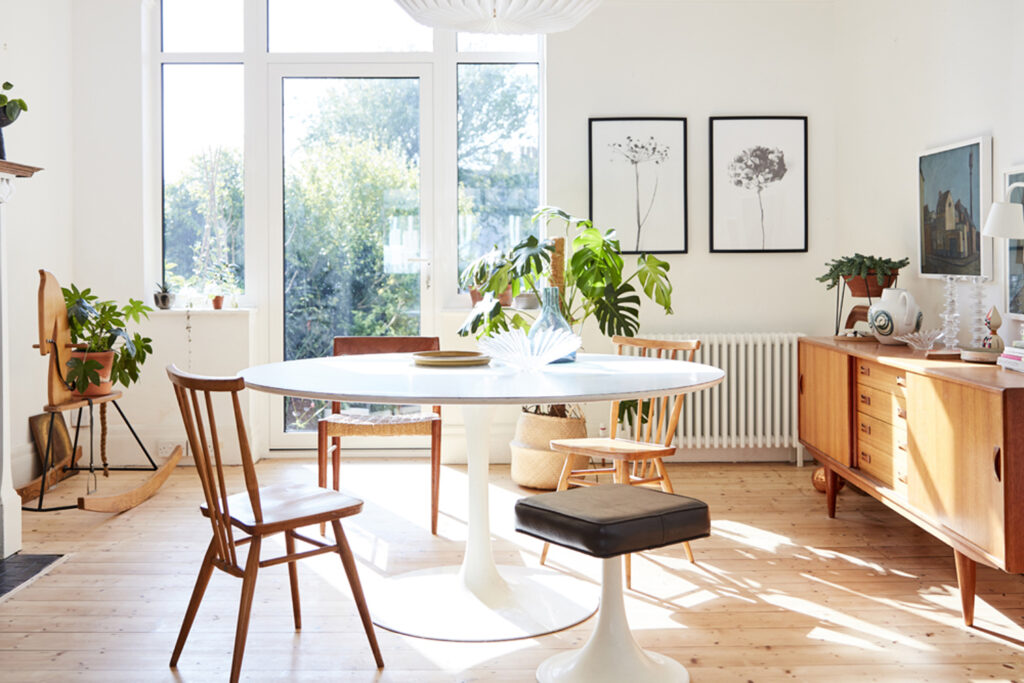 a living room filled with furniture and a large window