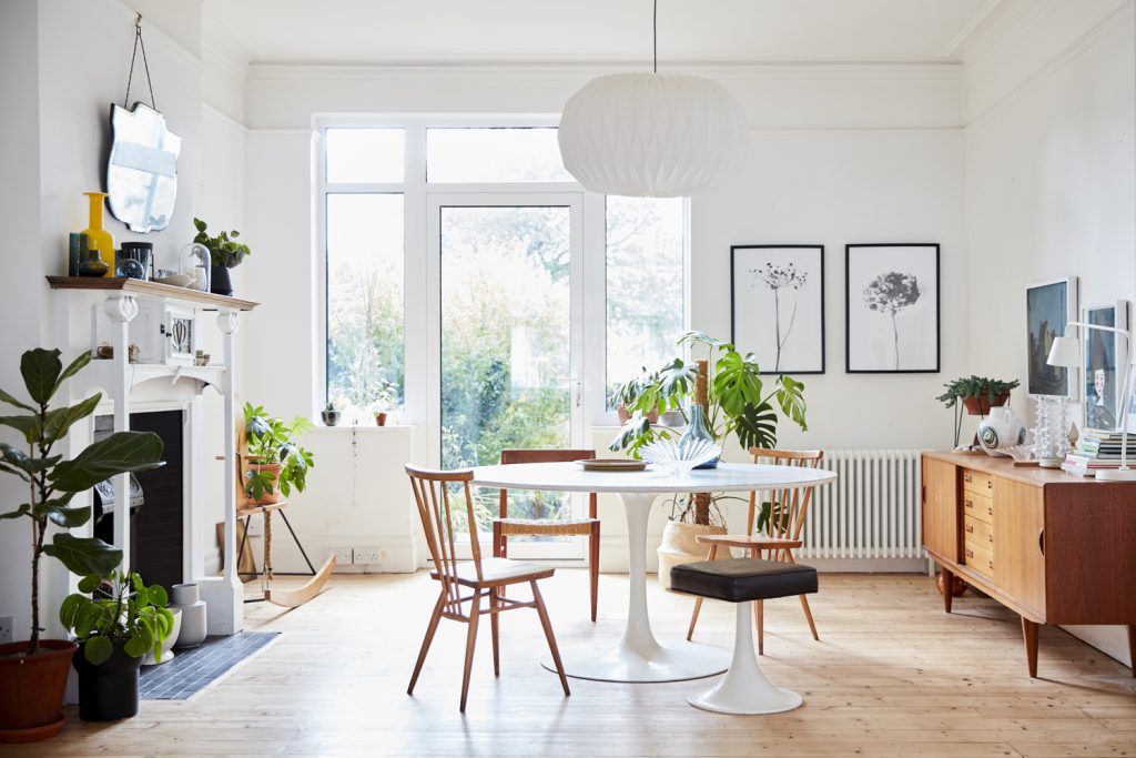 a living room filled with furniture and a large window