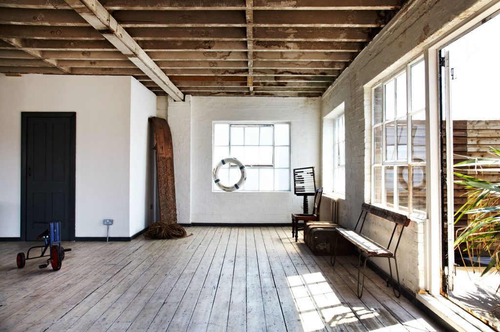 a room with a brick building