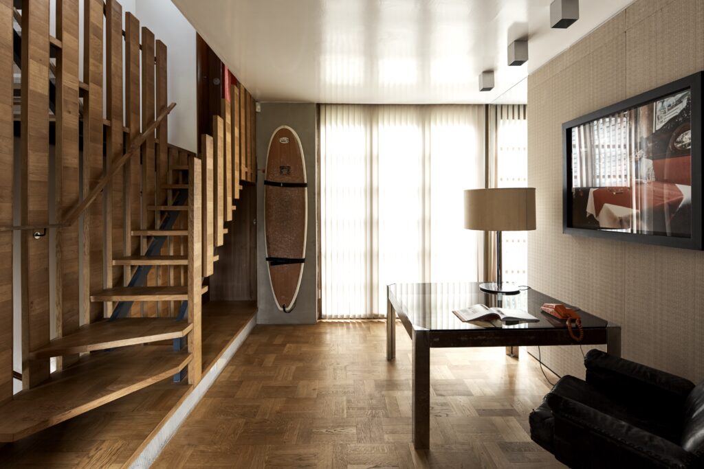 a living room filled with furniture and a large window