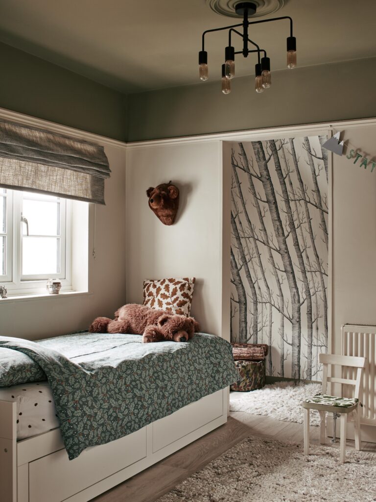 a bedroom with a bed in a room