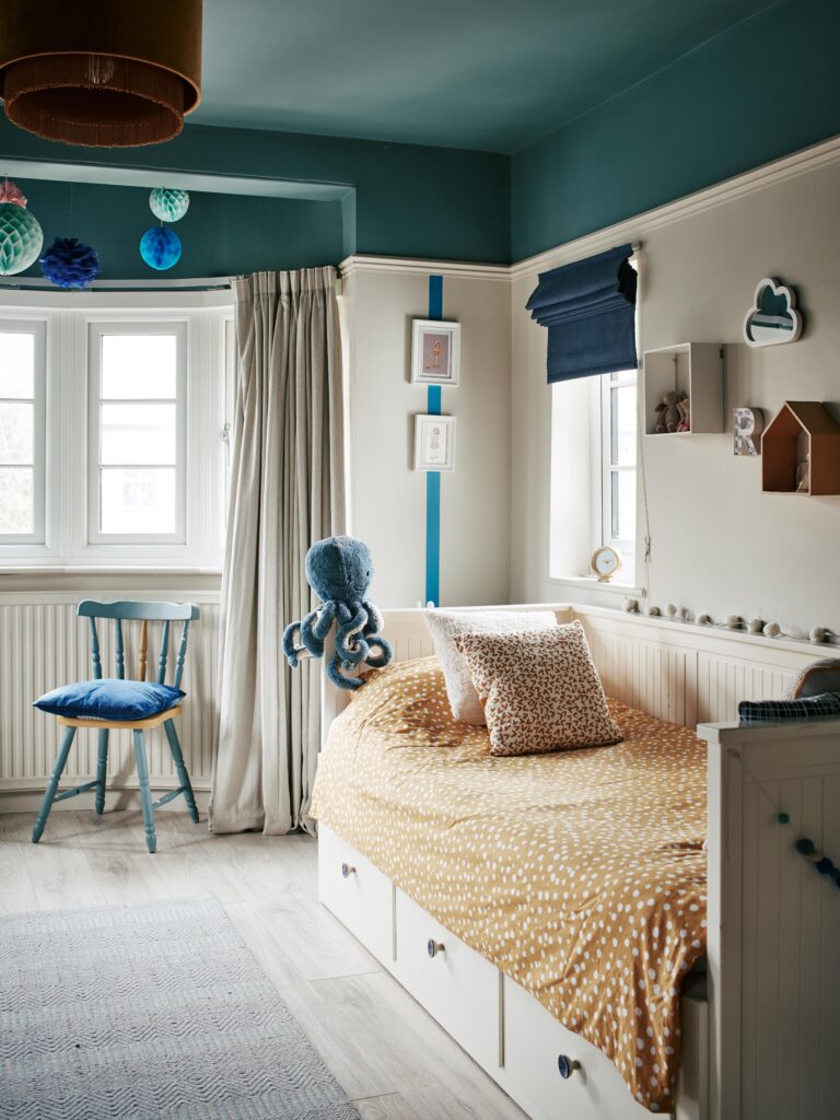 a bedroom with a bed and a mirror