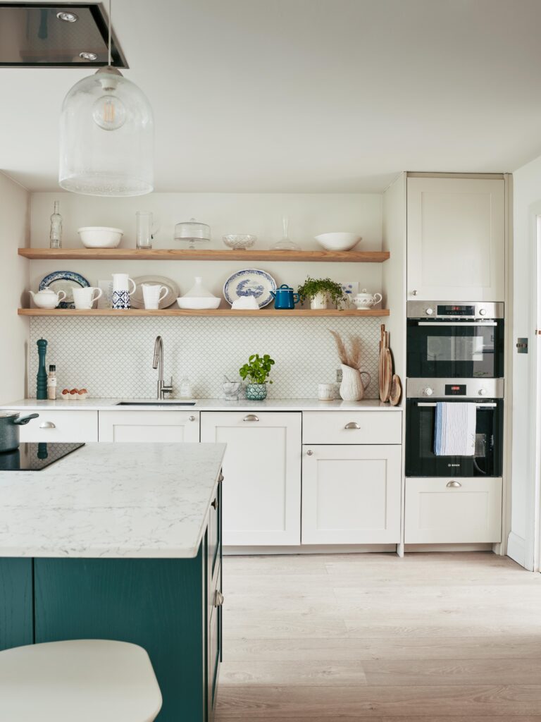 a kitchen with a sink and a refrigerator
