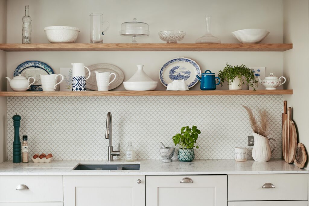 a kitchen with a sink and a mirror