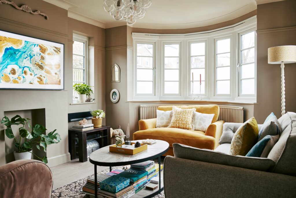 a living room filled with furniture and a large window