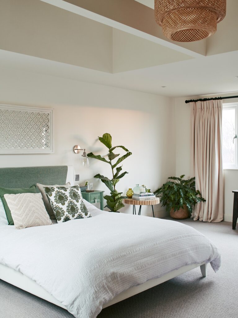a bedroom with a large bed in a room