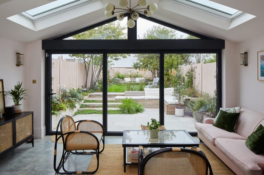 a living room filled with furniture and a large window