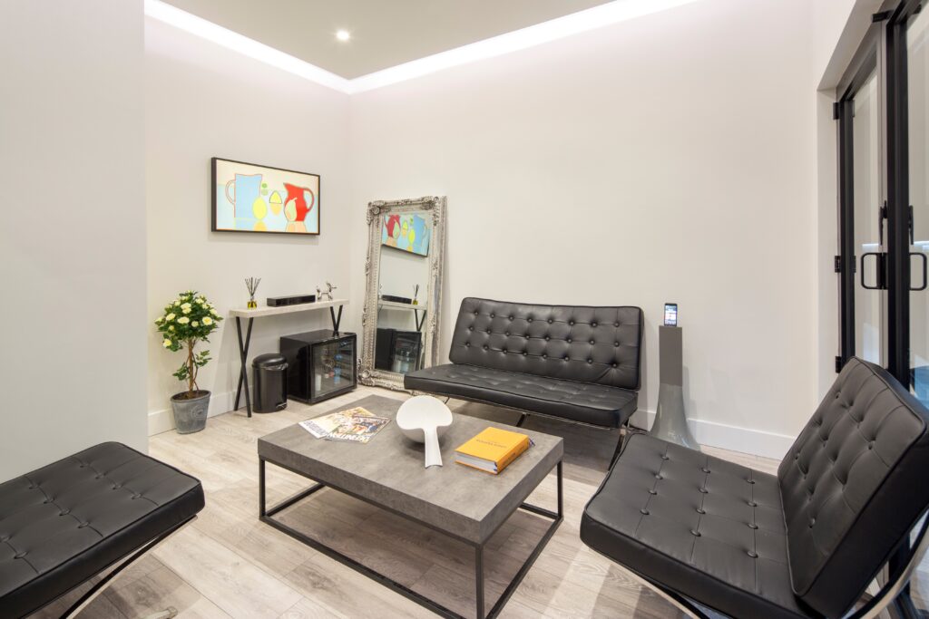 a living room with a desk and chair