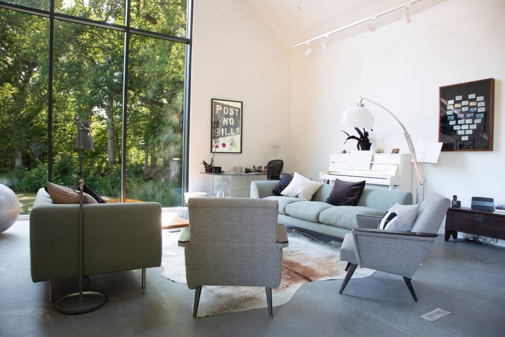a living room filled with furniture and a fireplace