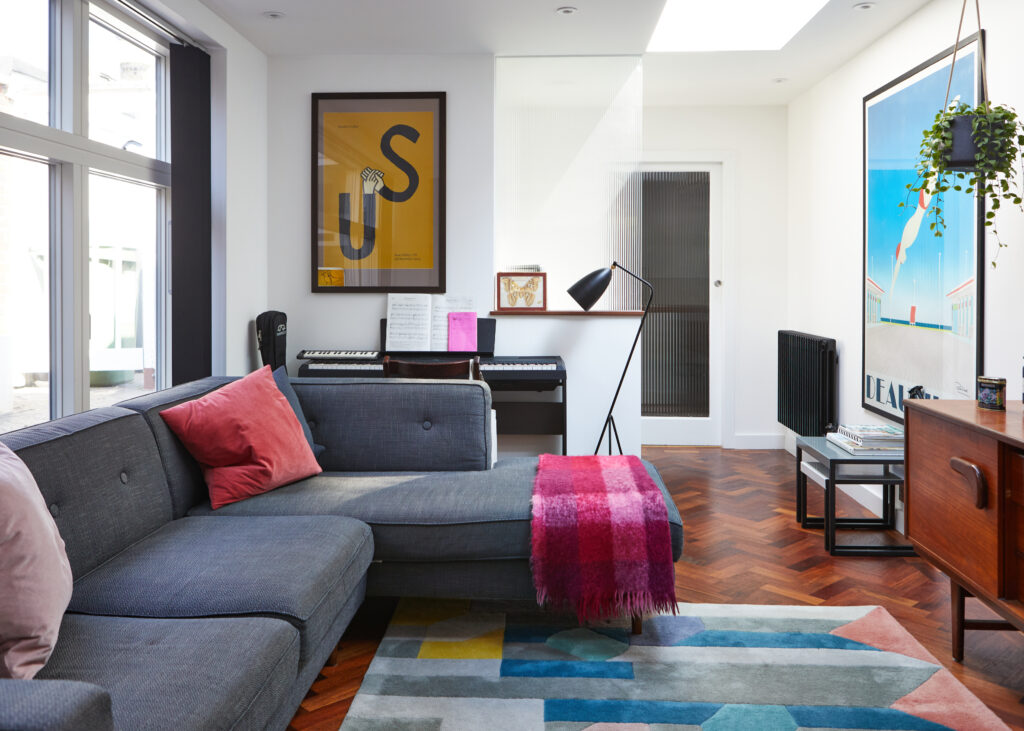 a living room filled with furniture and a large window