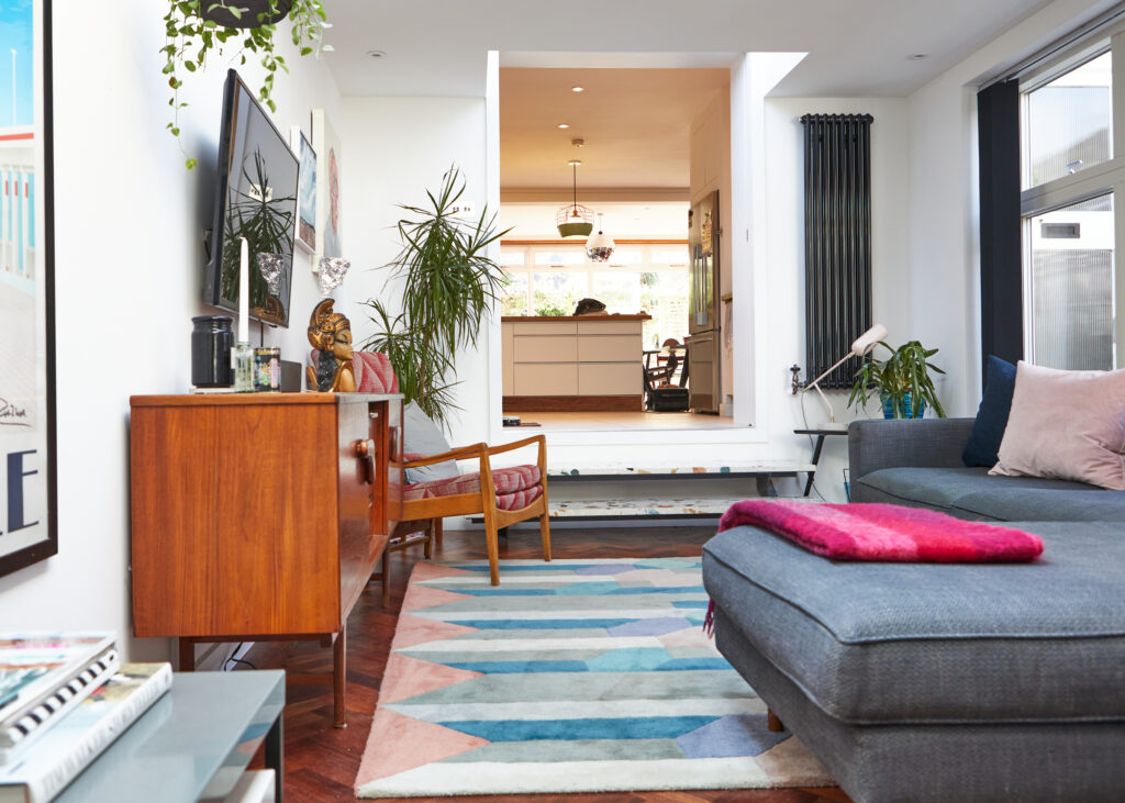 a living room filled with furniture and a fire place