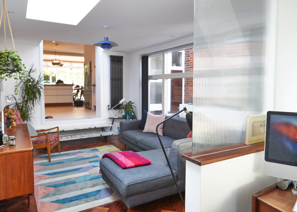 a living room filled with furniture and a flat screen tv