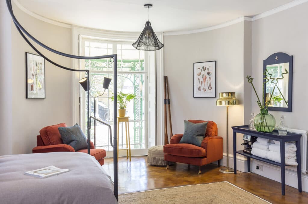 a bedroom with a view of a living room