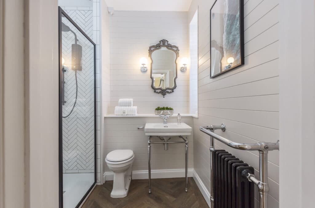 a room with a sink and a mirror