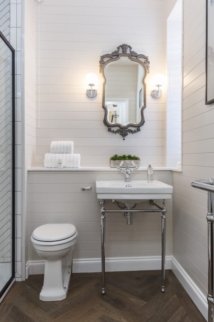 a room with a sink and a mirror