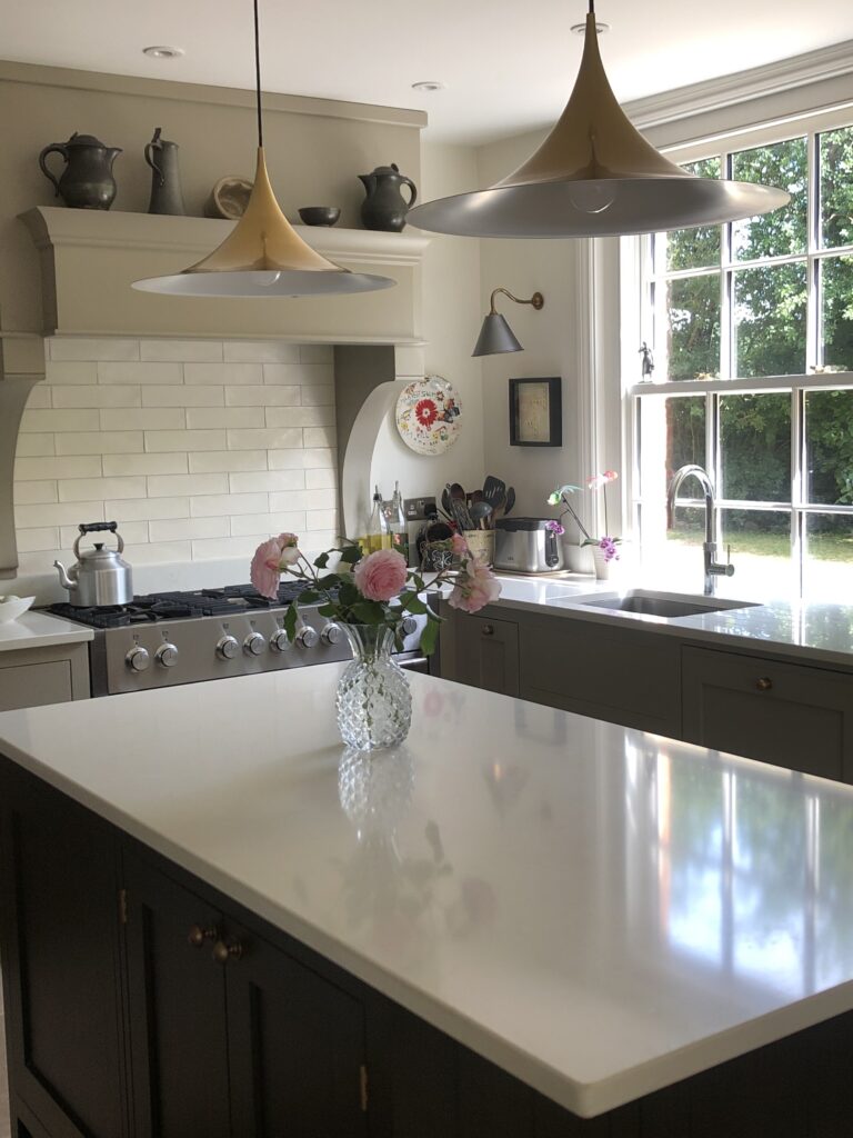 a kitchen with a sink and a mirror