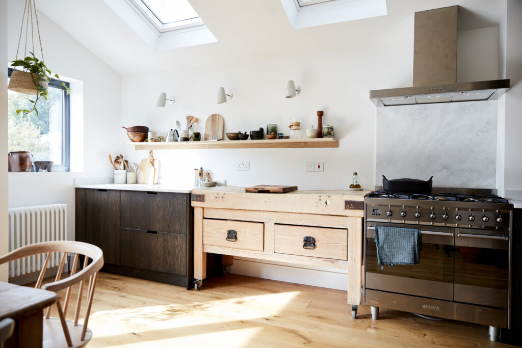 a kitchen with wooden cabinets and a fireplace