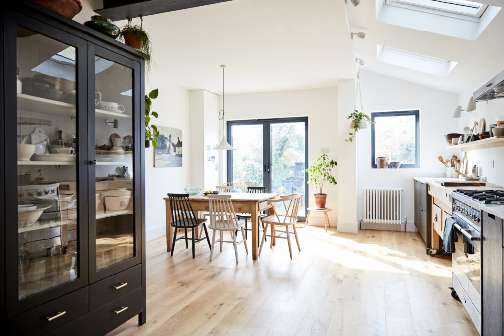 a room filled with furniture and a large window