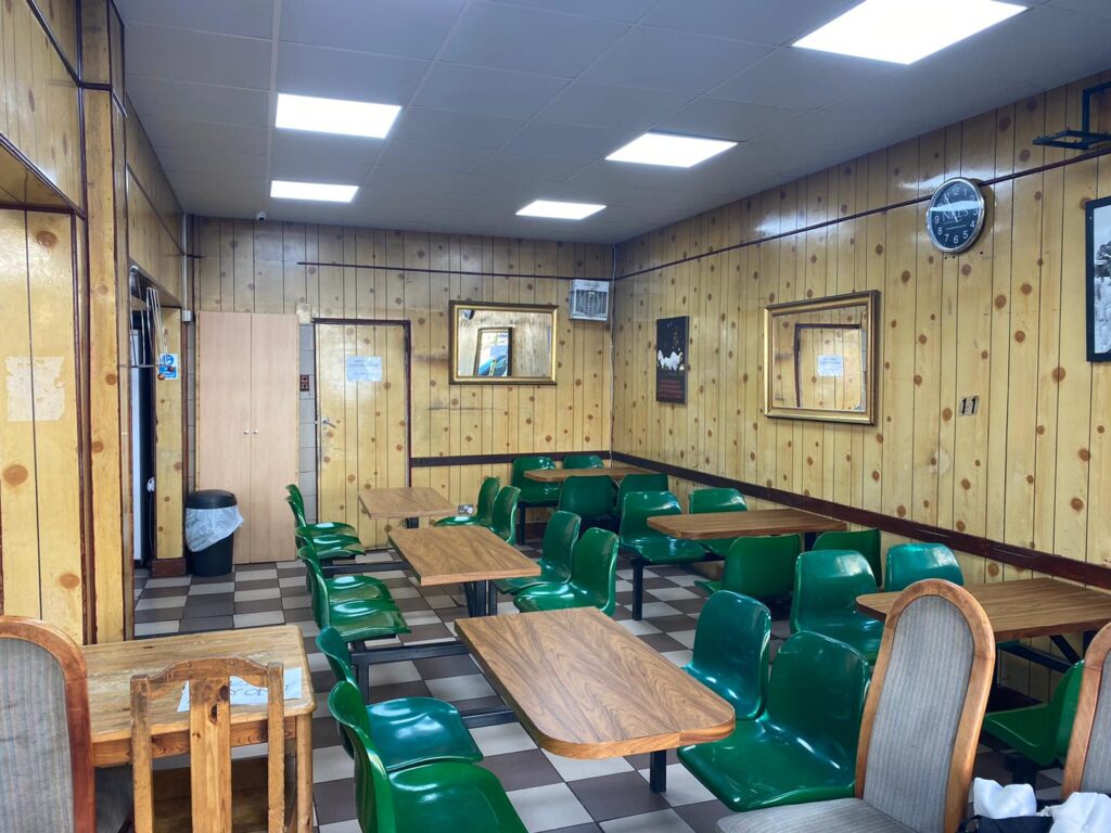 a room filled with furniture on top of a wooden chair