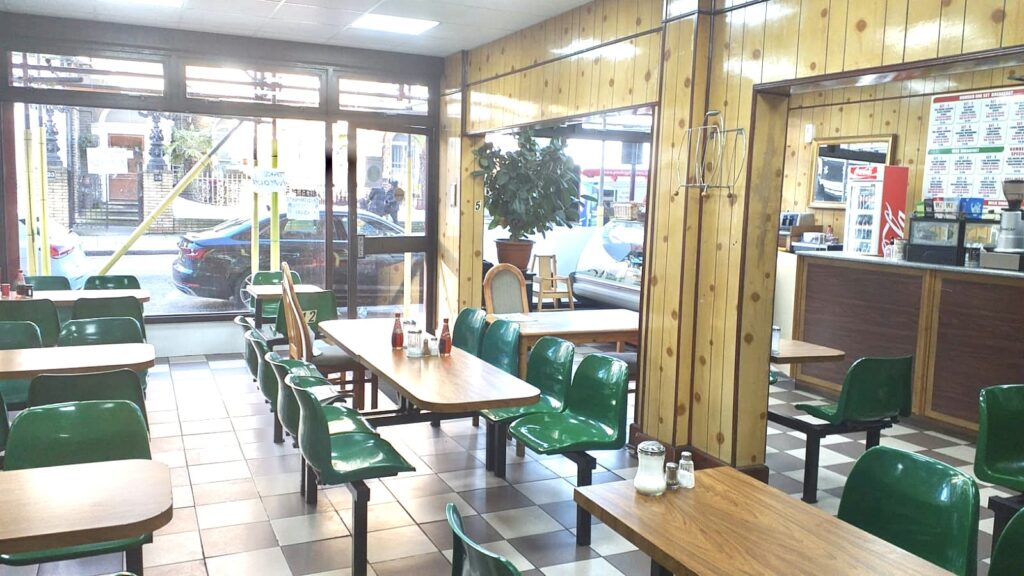 a dining room table in front of a window