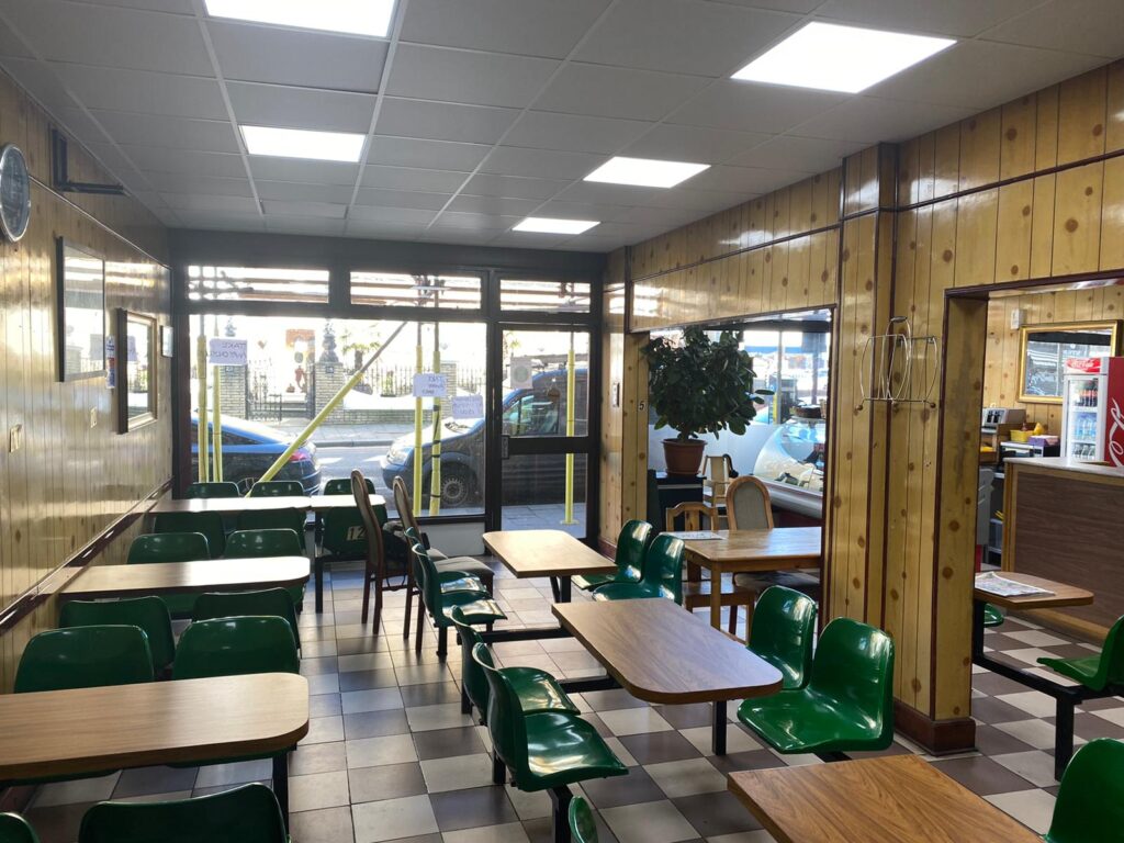 a room filled with furniture and a large window