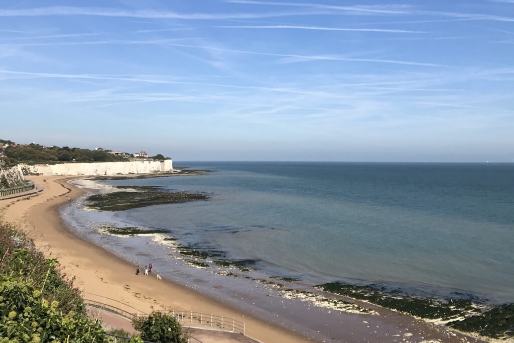 a view of a beach next to a body of water