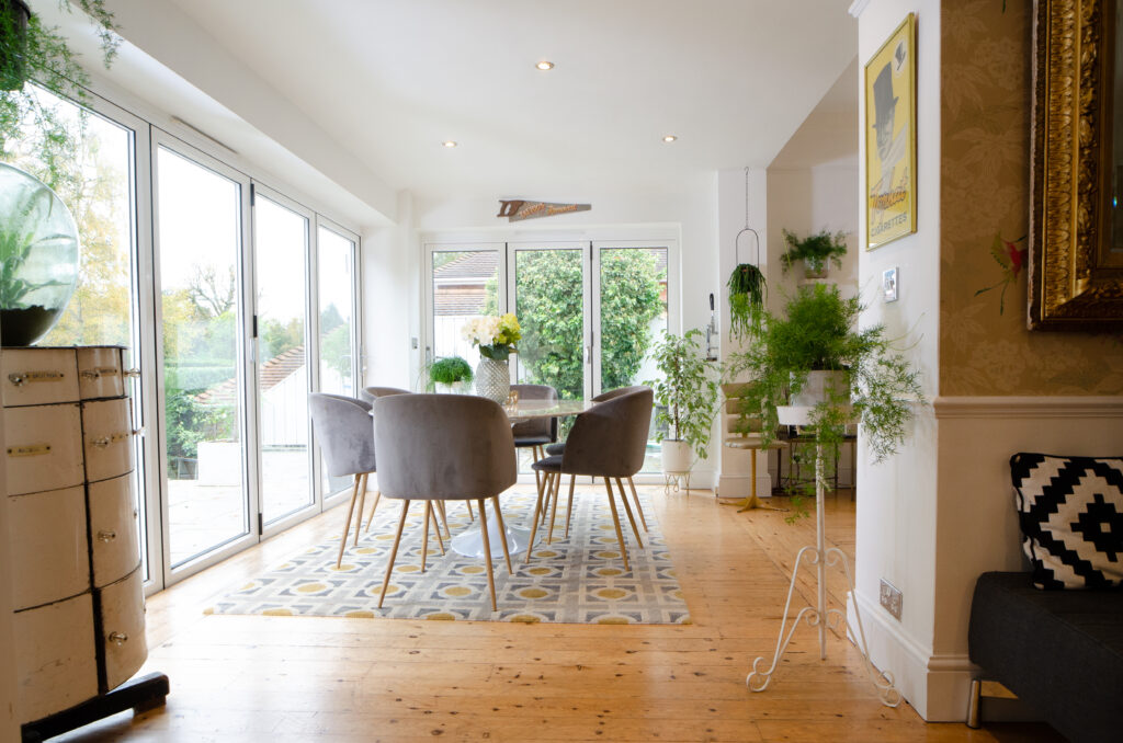 a living room filled with furniture and a large window
