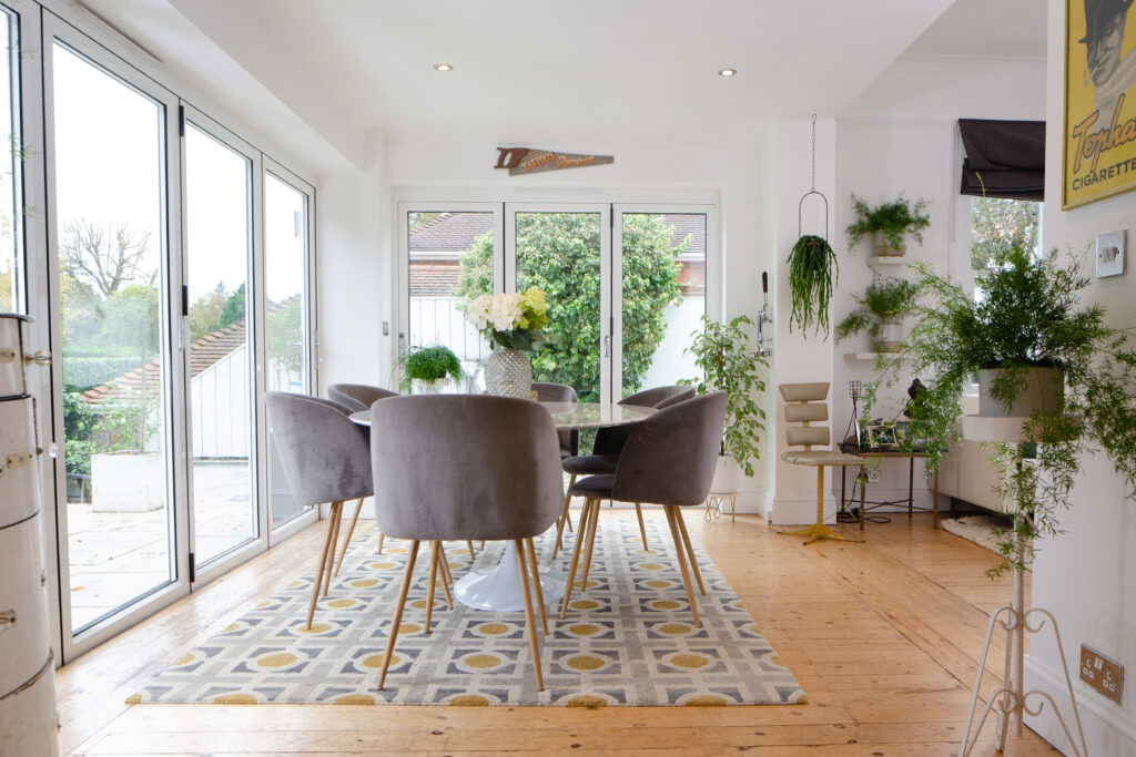 a living room filled with furniture and a large window