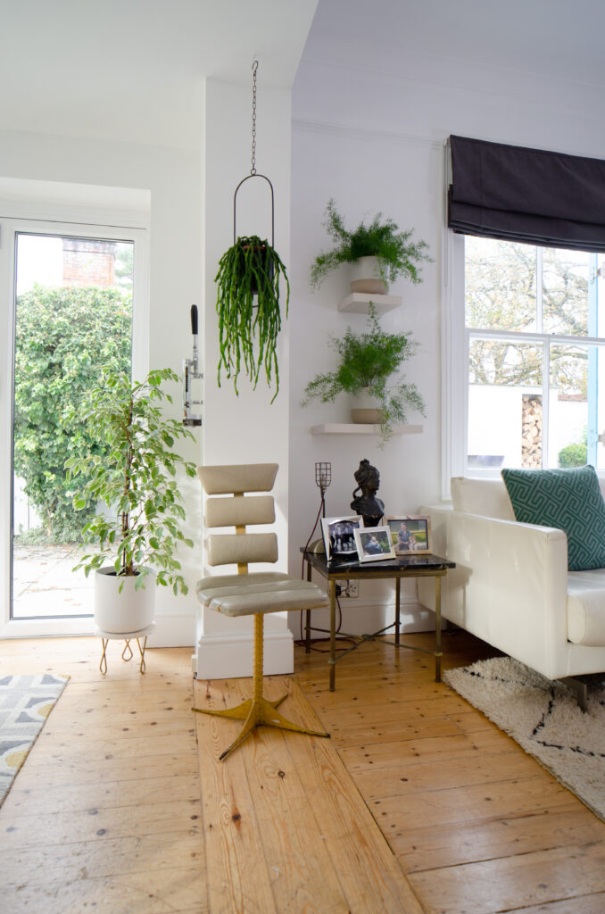 a living room filled with furniture and a large window