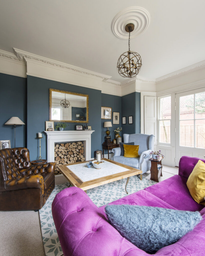 a living room with a purple chair