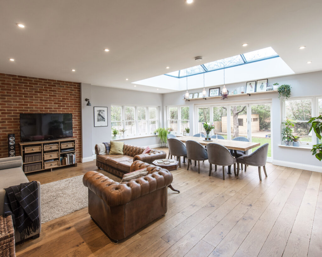 a living room filled with furniture and a fireplace