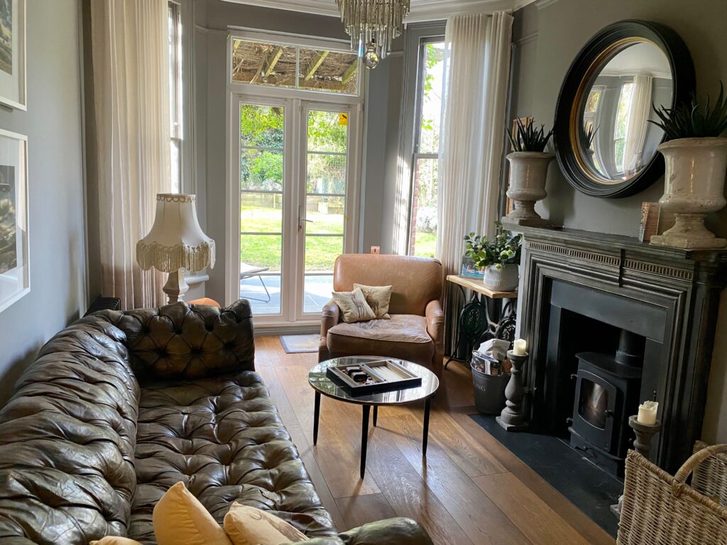 a living room filled with furniture and a fire place