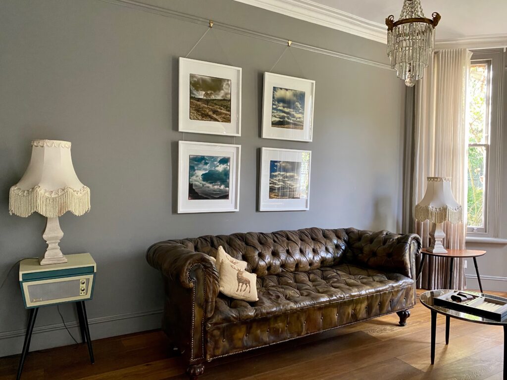 a living room filled with furniture and a large window