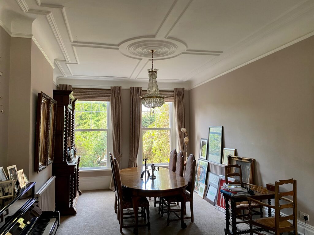 a living room filled with furniture and a large window
