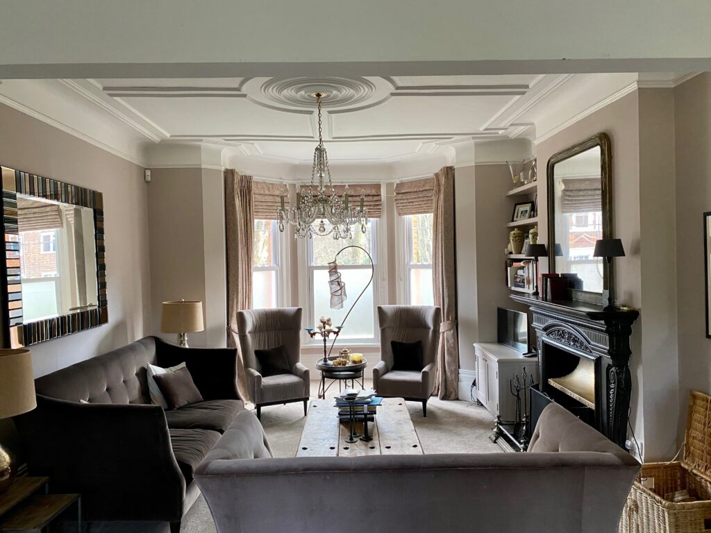 a living room filled with furniture and a large window
