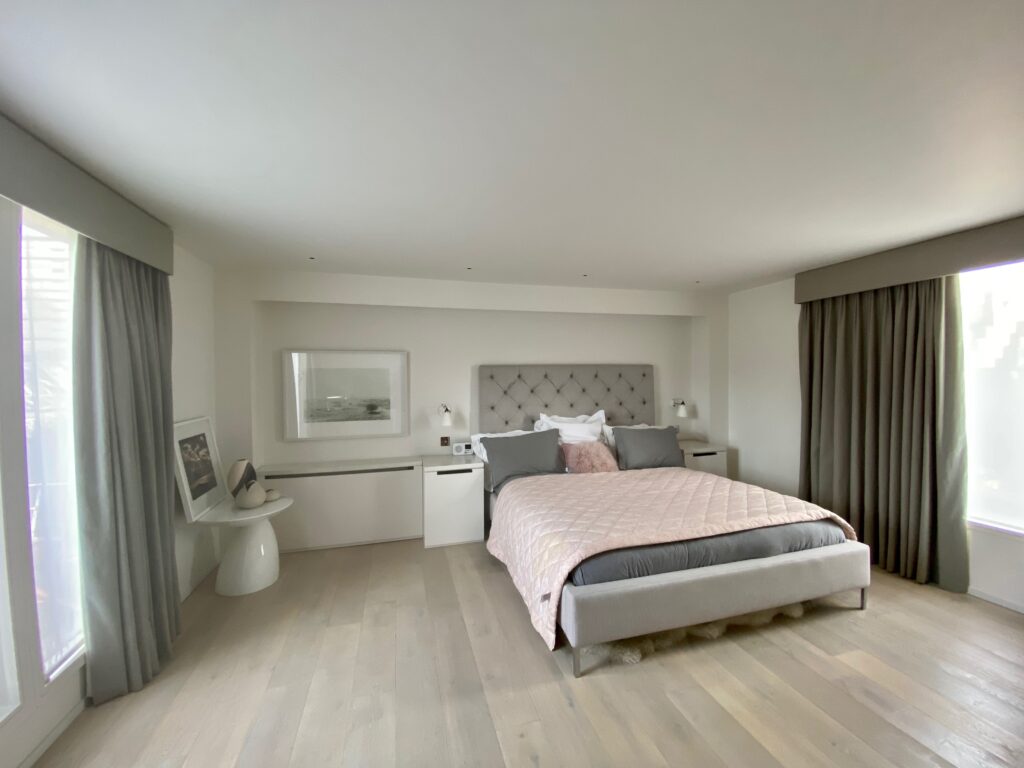 a bedroom with a bed in a room