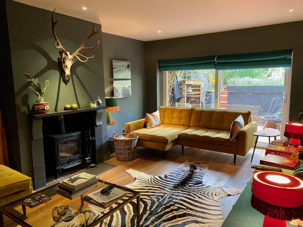 a living room filled with furniture and a fire place