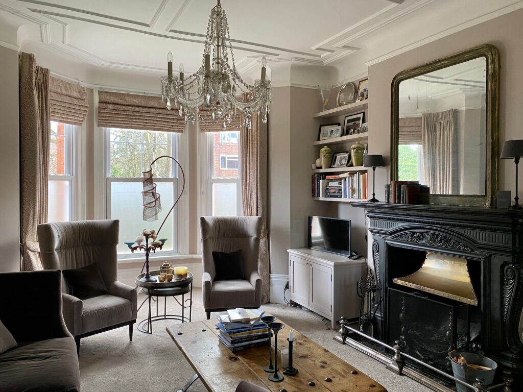 a living room filled with furniture and a large window
