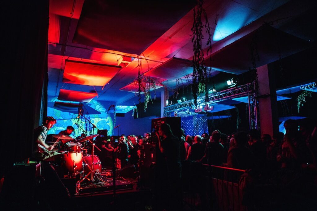 a group of people on a stage in front of a crowd