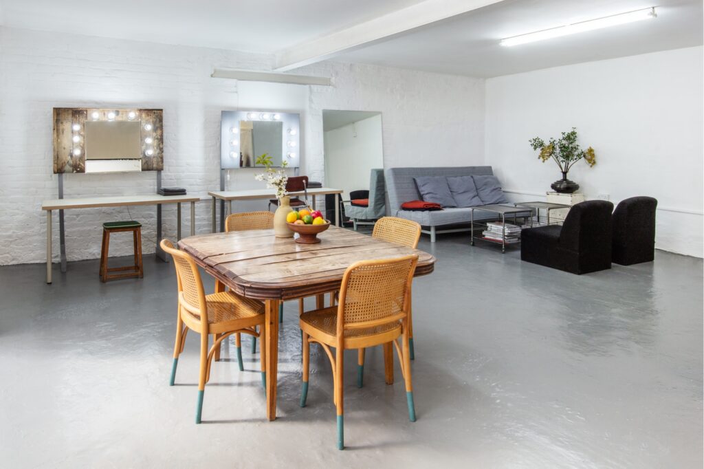 a room filled with furniture and a table