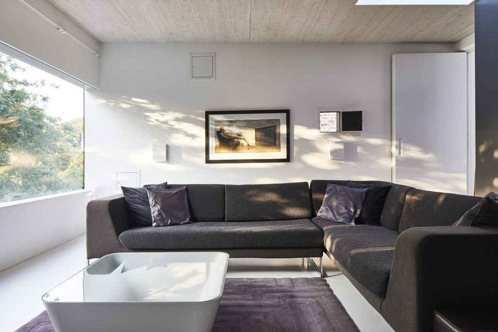 a living room filled with furniture and a large window