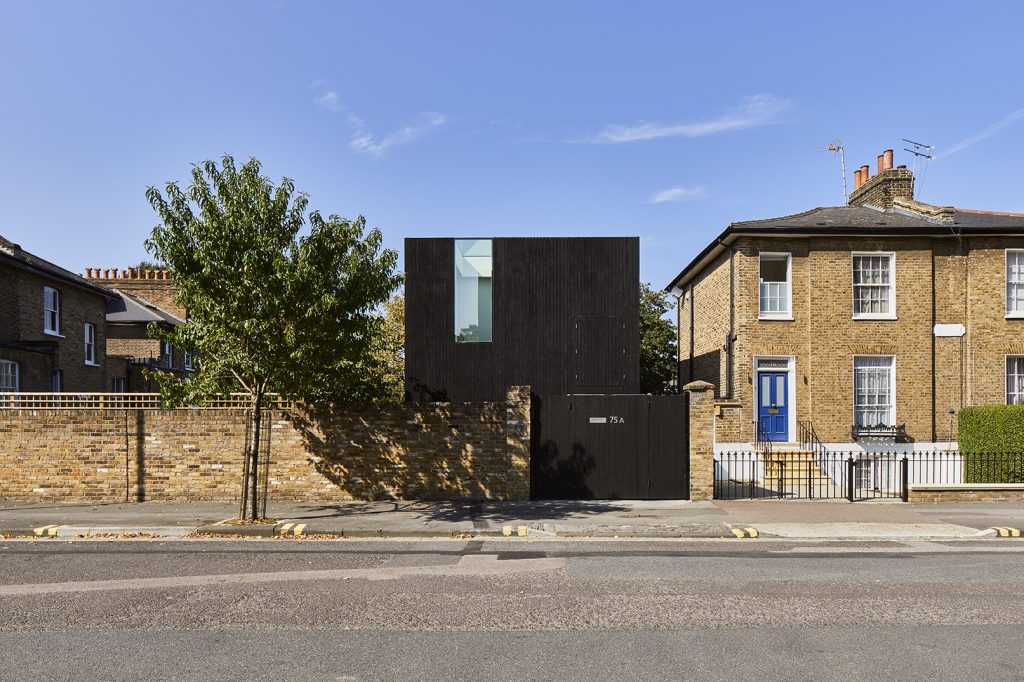 a close up of a street in front of a brick building