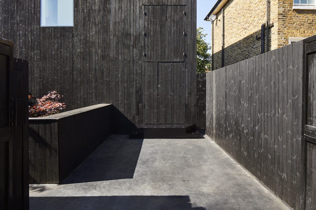 a building with a wooden fence