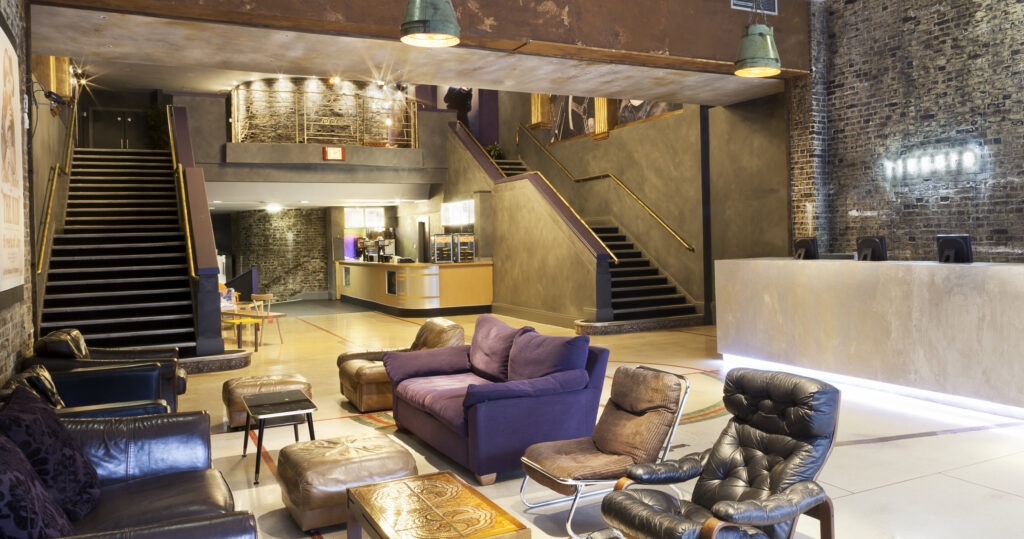a living room filled with furniture and a fireplace