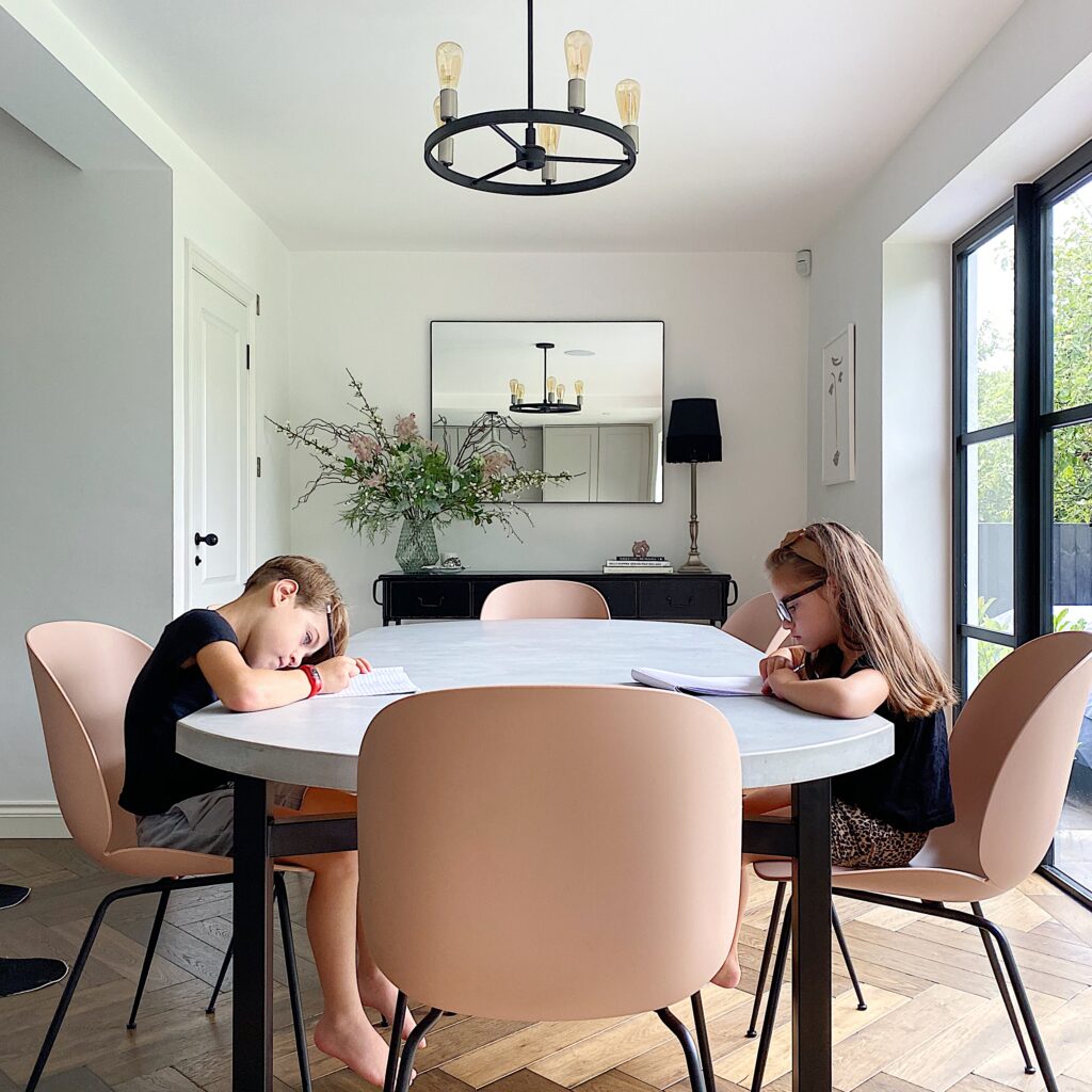 a person sitting at a table in a room