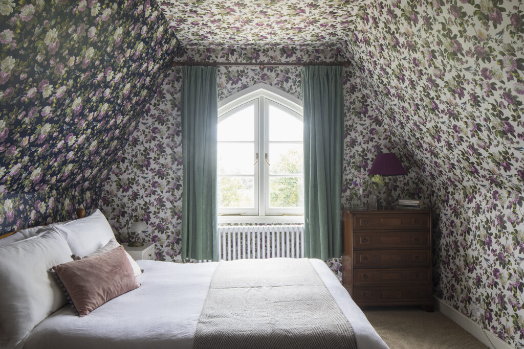 a bedroom with a large bed in a room