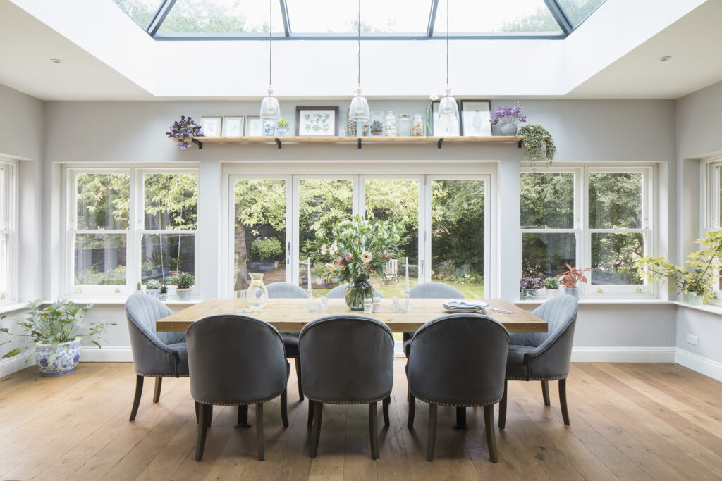 a living room filled with furniture and a large window